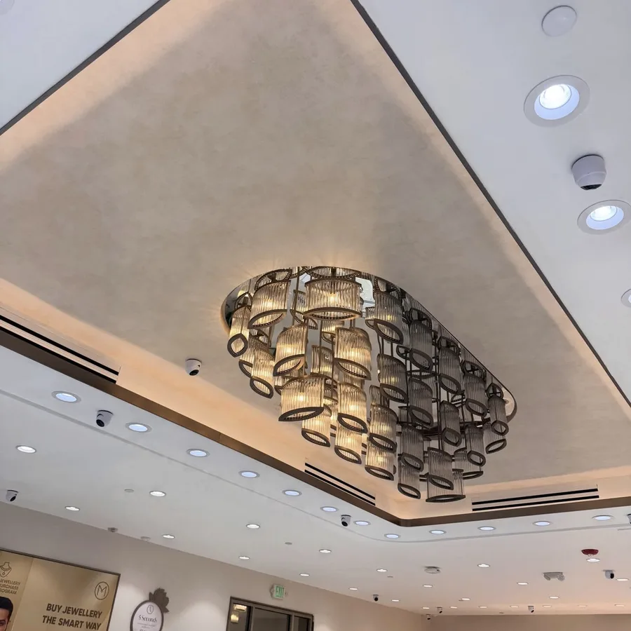 Commercial ceiling wallpaper installation in a retail store