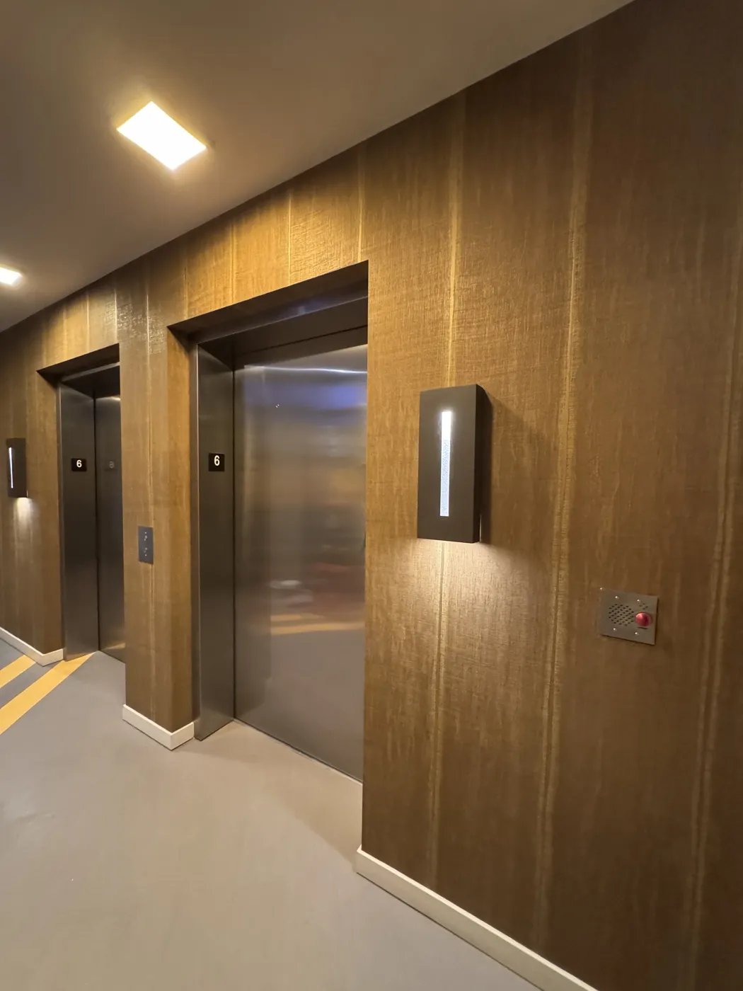 Commercial textured wallcovering in a multifamily elevator lobby